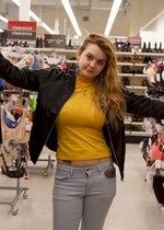 Busty babe topless in a store