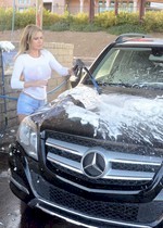Busty babe washing a car