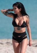 Busty babe in a black bikini