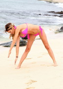 Chloe Sims stretching in a bikini