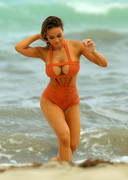 Curvy Asian babe in a swimsuit