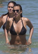 Devin Brugman in a black bikini