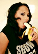 Busty Dominno sucking and licking a banana