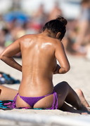 Erika Medina topless at the beach