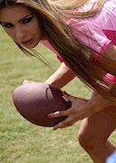 Busty latin babe playing Football