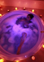 Busty babe in a hot tub