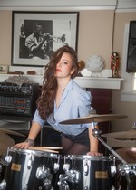 Busty and topless drummer chick