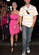 Holly Madison pokies in a pink dress