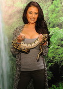 Busty babe holding a snake