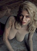 Busty blonde covered with mud