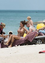 Katie Price topless at beach