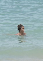 Katie Price topless at beach