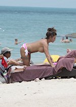 Katie Price topless at beach