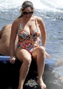 Kelly Brook is busty in a swimsuit