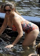 Kelly Brook is busty in a swimsuit