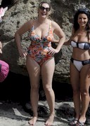 Kelly Brook is busty in a swimsuit