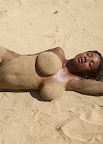 Busty ebony babe at the beach