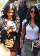 Kardashian sisters looking busty