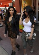 Kardashian sisters looking busty