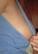 Lucy V strips out of a blue top