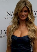 Busty model Marisa Miller promotes a lotion