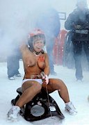 Naked snow sledding