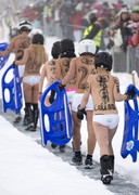 Naked snow sledding