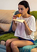 Busty girl eats Pizza