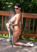 Nikki Sims with a hose