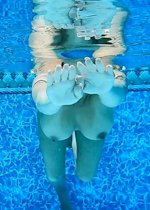 Busty girl swimming nude