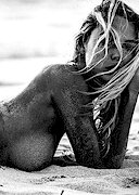 Naked blonde at the beach