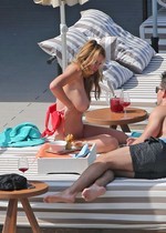 Rhian Sugden topless sunbathing