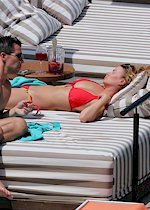 Rhian Sugden topless sunbathing