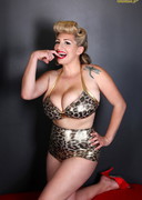 Busty pinup in leopard lingerie