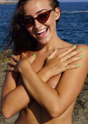 Busty beach flasher