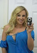 Busty blonde snap pics in the mirror