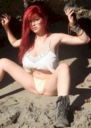 Tessa Fowler topless in a cave