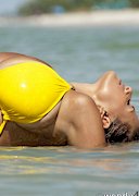 Big tit babe in a yellow bikini
