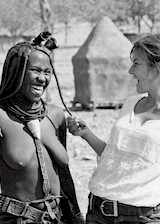 Topless white woman in Africa