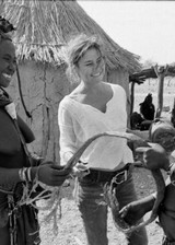 Topless white woman in Africa