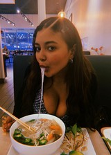 Busty girl eating soup