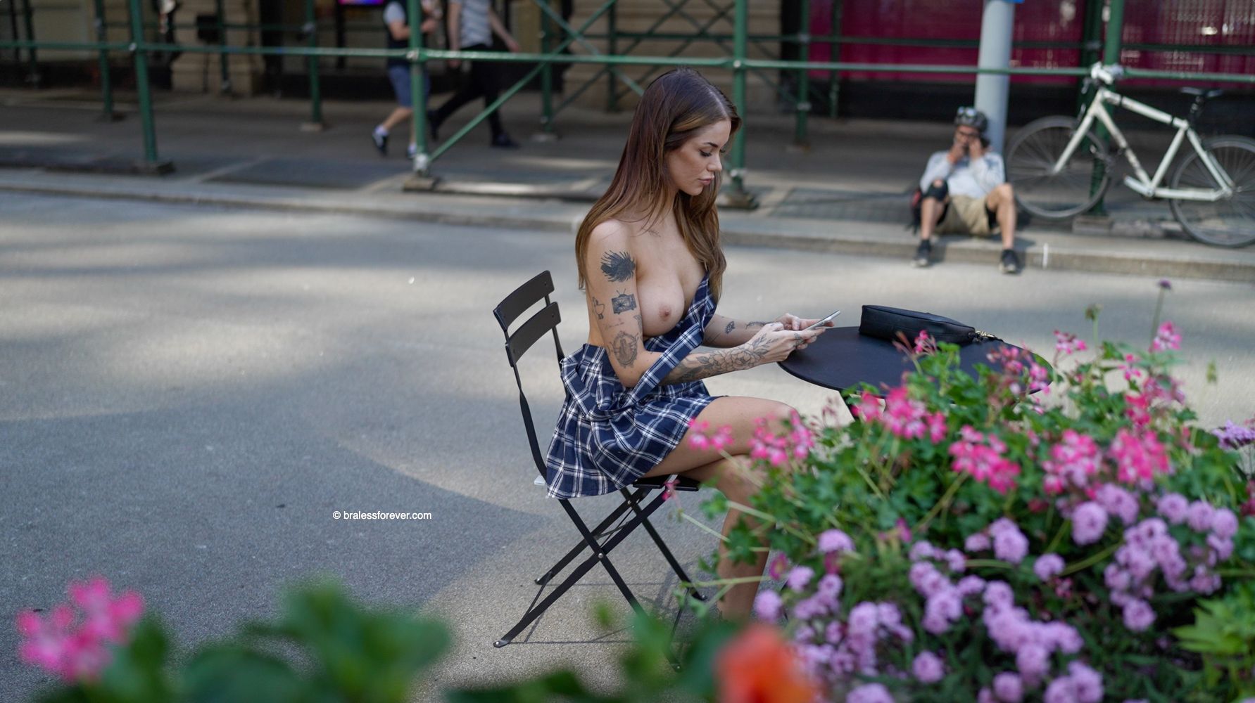 Watch the FULL video of this busty babe going braless in public! 