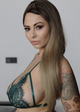 Tattooed Chick With Large Breast Fingering Her Pussy