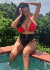 Tara Yazdi Is An Busty Brunette Displaying Her Curves In Various Bikinis