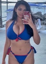 Tara Yazdi Is An Busty Brunette Displaying Her Curves In Various Bikinis