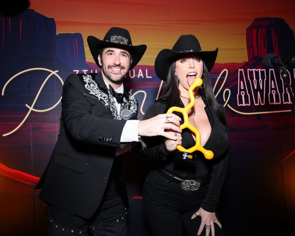Cowboy and cowgirl being goofy on the red carpet