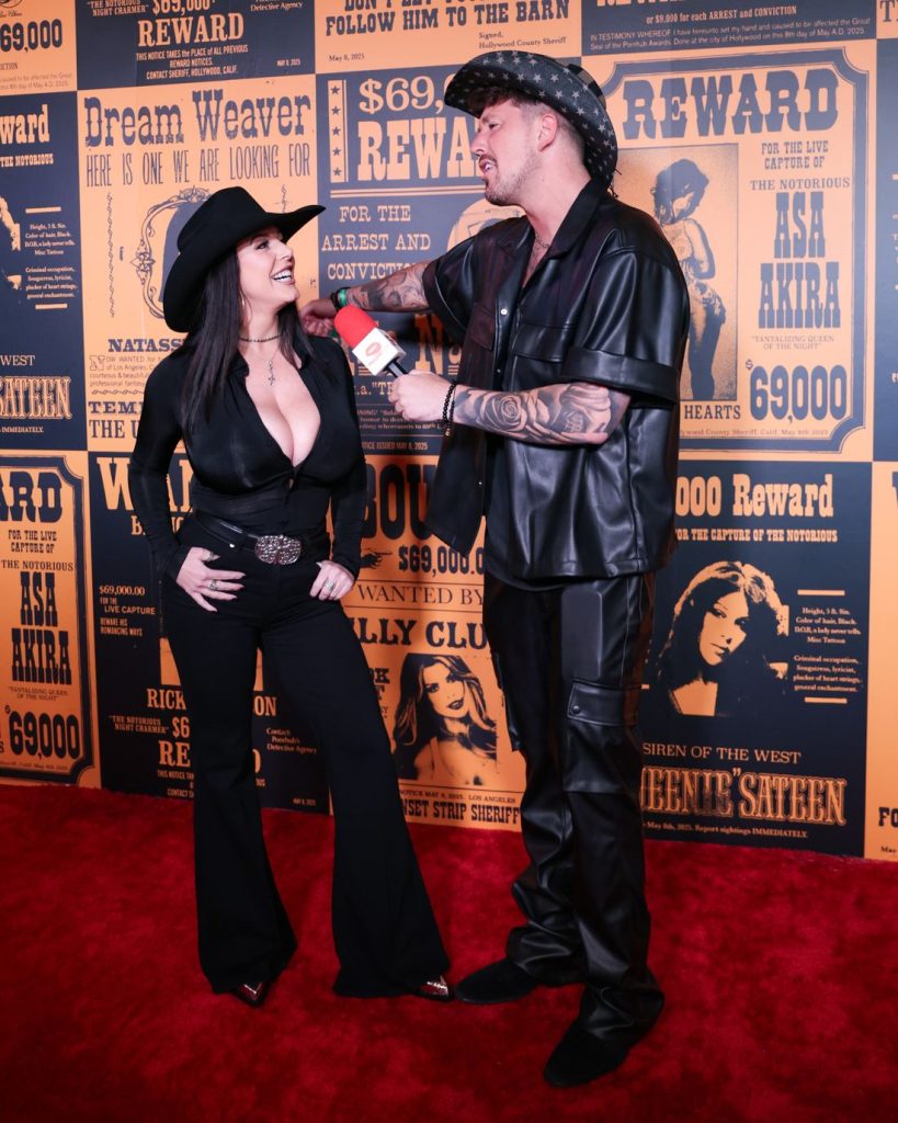 Cowboy interviewing a big boob cowgirl on the red carpet