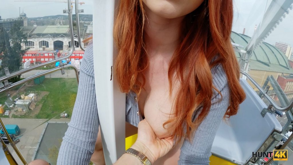 Grabbing a redhead's tit while high up in a Ferris wheel