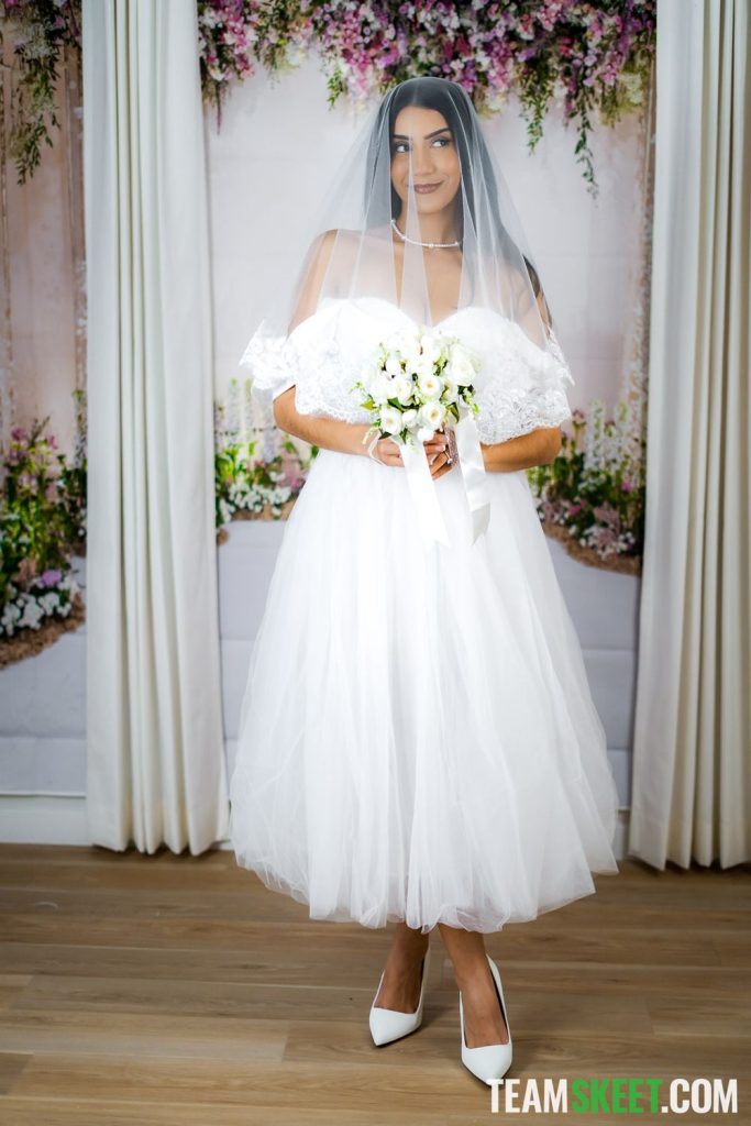 Arab girl looking pretty in a white wedding dress
