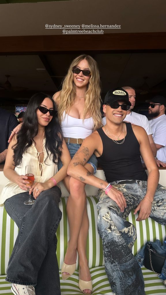 Busty blonde in the center between a hot brunette babe and some guy